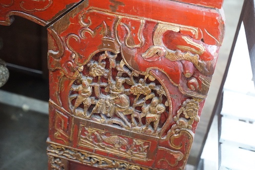 A Chinese carved scarlet and gilt painted altar table with faux stone top, length 198cm, depth 41cm, height 98cm